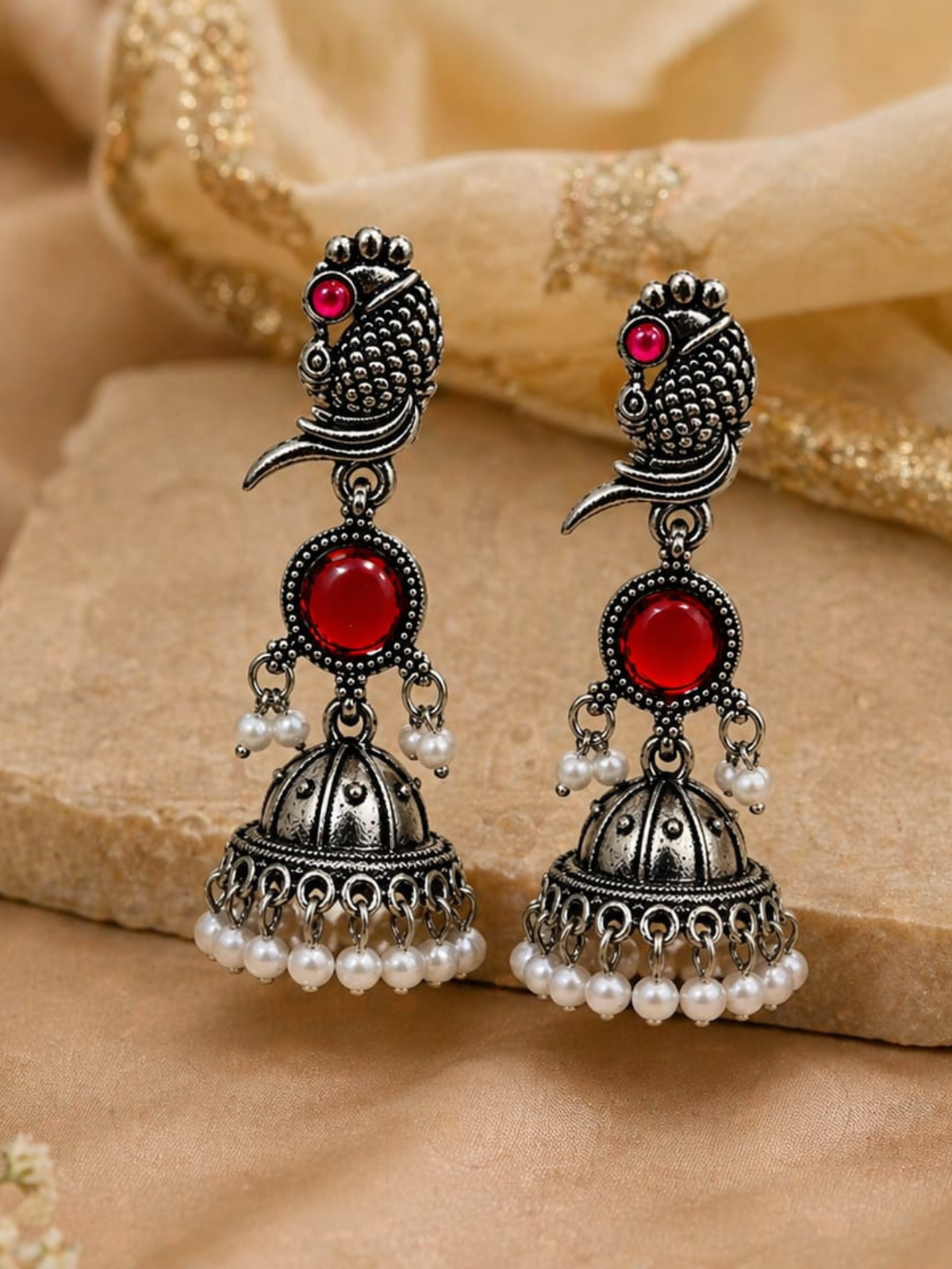 KAYAANSH Oxidized Silver Peacock Jhumka Earrings with Ruby Red Stone & Pearl Drops